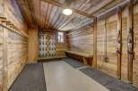 Step into a rustic ski storage room, perfect for organizing your gear.