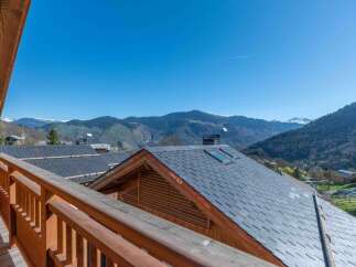 Enjoy breathtaking mountain views from this charming property.