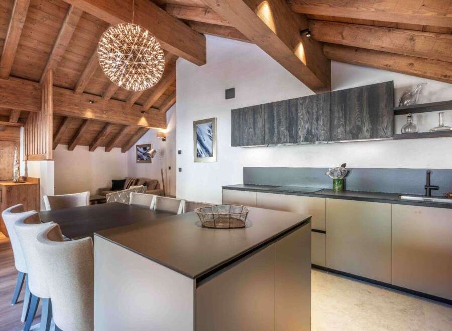 Experience luxury living in this stunning property! Featuring a modern kitchen with sleek cabinetry and a spacious island, perfect for culinary enthusiasts.