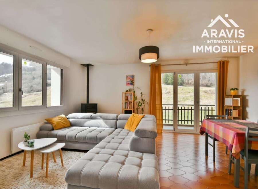 Discover this charming property featuring a spacious living area with a comfortable sectional sofa, perfect for relaxation.