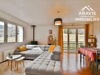 Discover this charming property featuring a spacious living area with a comfortable sectional sofa, perfect for relaxation.