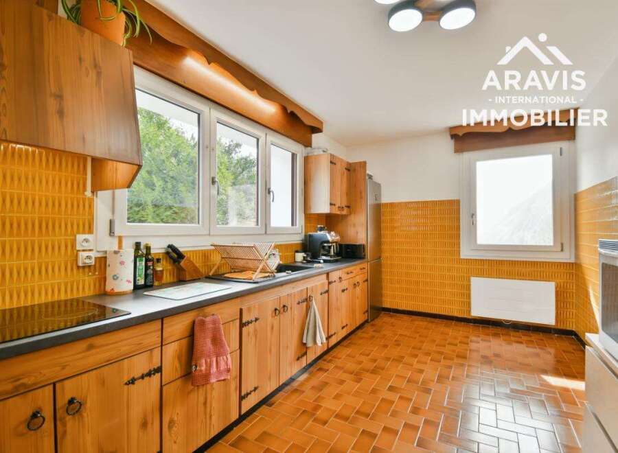 Step into this charming kitchen, featuring warm wooden cabinetry and a classic design.