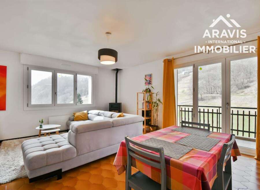 Discover this charming property featuring a cozy living space with a comfortable sofa and a fireplace, perfect for relaxing evenings.