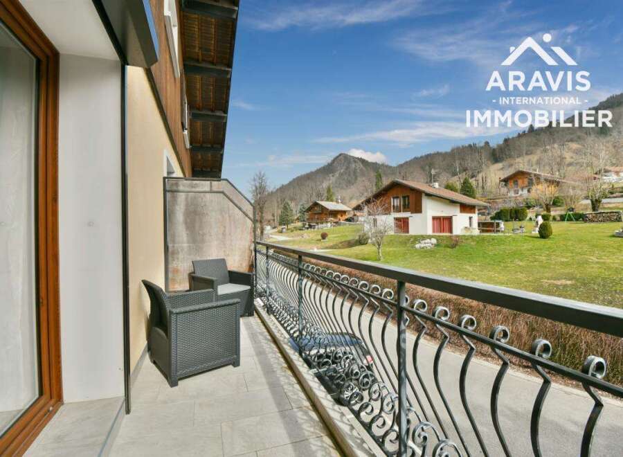 Enjoy breathtaking mountain views from this charming balcony.