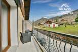 Enjoy breathtaking mountain views from this charming balcony.