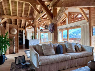 Experience luxury living in this stunning chalet, boasting exquisite wooden beams and panoramic mountain views.