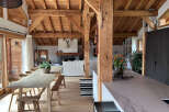 Experience rustic elegance in this stunning property, featuring exposed wooden beams and a cozy fireplace.