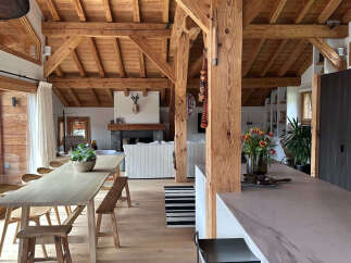 Experience rustic elegance in this stunning property, featuring exposed wooden beams and a cozy fireplace.