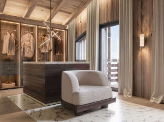 Step into luxury with this stunning walk-in closet, a perfect blend of style and functionality.