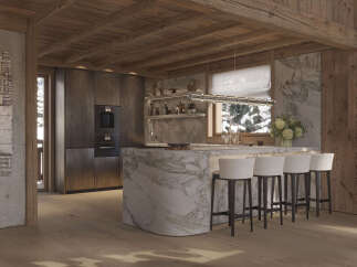 Experience luxury mountain living in this stunning chalet kitchen, featuring a dramatic marble island and sleek, dark cabinetry.