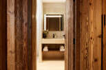 Step into luxury with this stunning property featuring exquisite wood paneling and a beautifully designed bathroom.