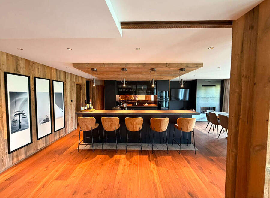 Experience luxury mountain living in this stunning open-concept kitchen and dining area.