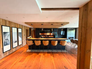 Experience luxury mountain living in this stunning open-concept kitchen and dining area.