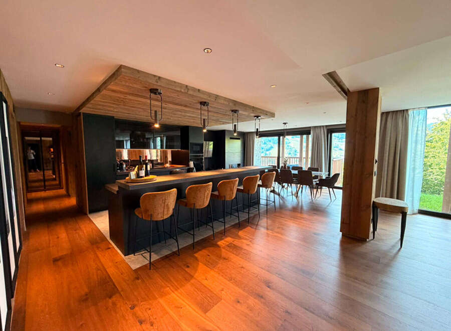 Experience modern mountain living in this stunning open-concept kitchen and dining area.