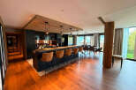 Experience modern mountain living in this stunning open-concept kitchen and dining area.