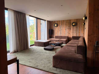 Experience luxury living in this stunning living room, featuring a plush sectional sofa perfect for relaxation and entertaining.
