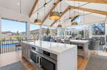 Experience luxury living in this stunning kitchen with breathtaking mountain views.