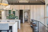 This stunning property boasts a modern kitchen with sleek countertops and stylish pendant lighting, perfect for culinary enthusiasts.