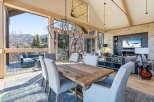 Experience luxury living in this stunning property, featuring a spacious dining area with breathtaking mountain views.