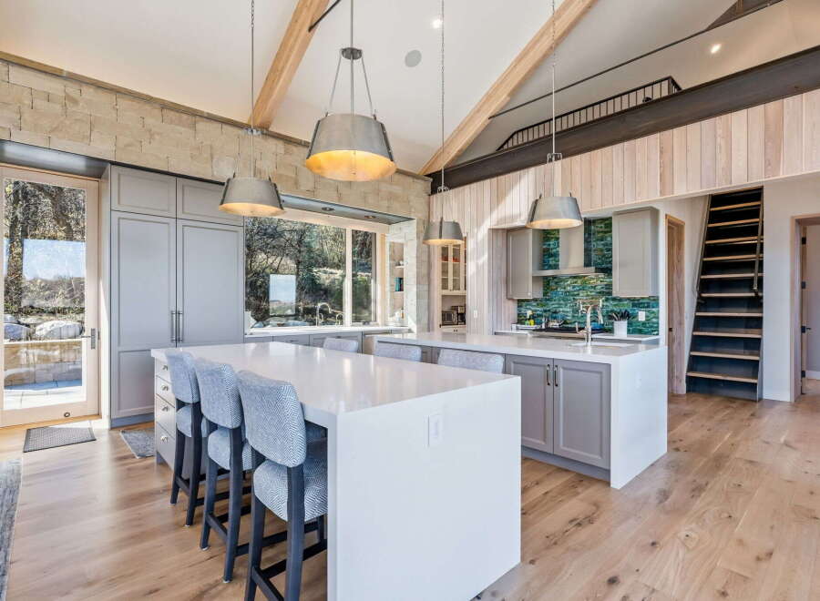 This stunning kitchen boasts a modern design with high-end finishes.