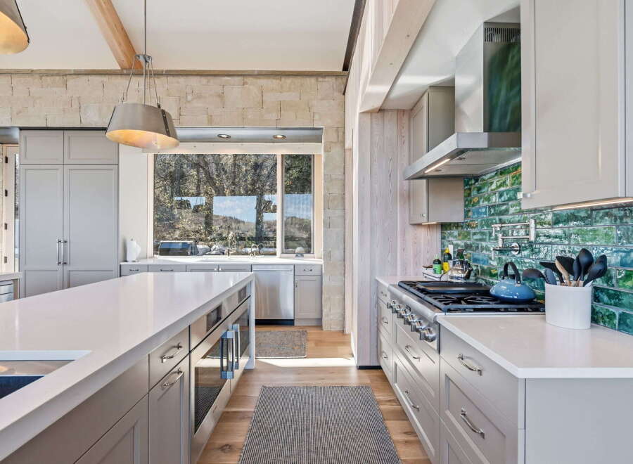 This stunning kitchen boasts a modern design with high-end finishes.