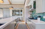 This stunning kitchen boasts a modern design with high-end finishes.