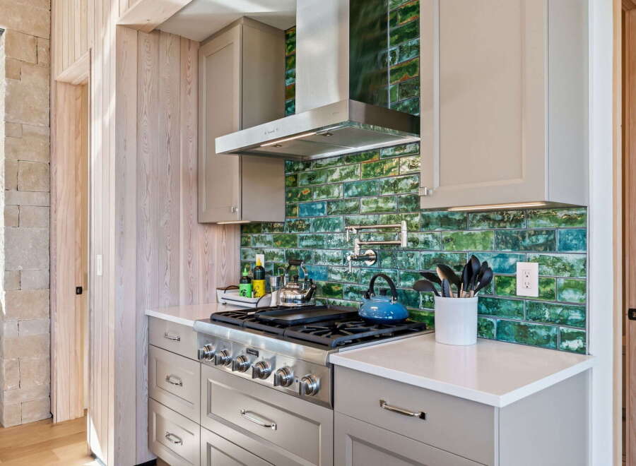 This stunning kitchen boasts a modern design with high-end appliances and finishes.