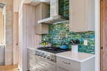 This stunning kitchen boasts a modern design with high-end appliances and finishes.