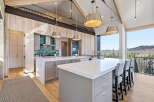 Experience luxury living in this stunning kitchen, featuring a spacious island with seating, perfect for entertaining.
