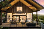 This stunning modern home boasts a striking architectural design with a warm, inviting ambiance.