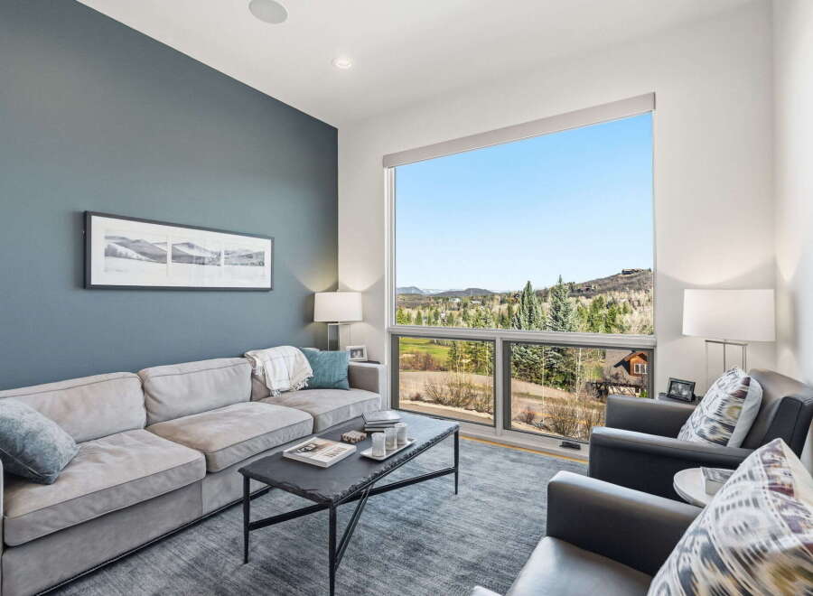 Experience luxury living with this stunning property, boasting a spacious living area with breathtaking views.