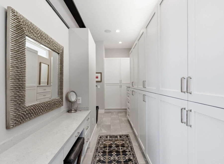 Step into luxury with this stunning walk-in closet.