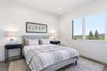 This stunning bedroom offers a serene retreat with its modern design and natural light.