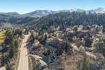 Nestled in a serene mountain landscape, this stunning property offers unparalleled views and luxurious living.