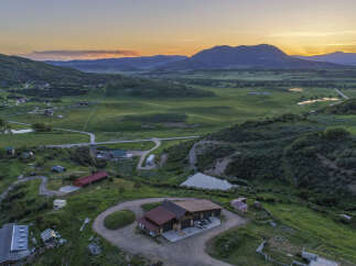Discover this expansive property nestled in a serene mountain landscape, perfect for those seeking tranquility and space.