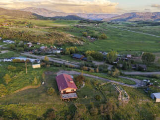 Discover this charming property nestled in a picturesque valley, offering breathtaking mountain views and serene rural living.