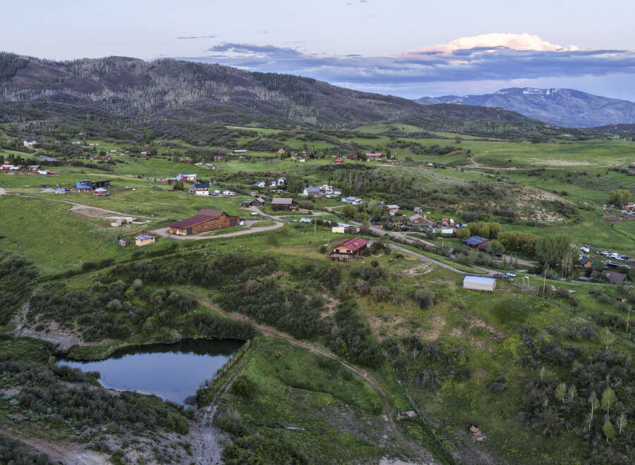 Discover this expansive property nestled in a serene mountain landscape, offering a unique blend of natural beauty and rural charm.
