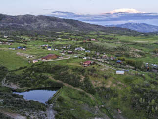 Discover this expansive property nestled in a serene mountain landscape, offering a unique blend of natural beauty and rural charm.