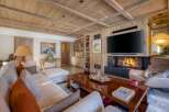 Experience the epitome of luxury living in this stunning property, featuring exquisite wooden accents and a cozy fireplace.