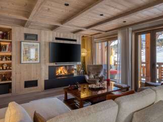Experience luxury living in this stunning property featuring a cozy fireplace, perfect for chilly evenings.