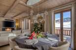 Experience luxury living in this stunning property, featuring a cozy fireplace and a beautifully decorated dining area perfect for entertaining.