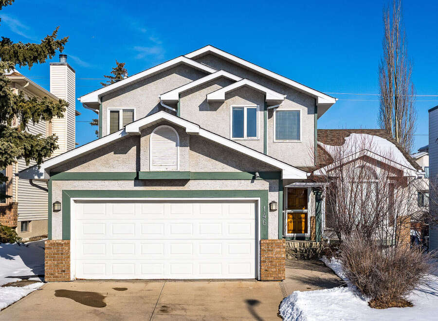 This stunning two-story home boasts a charming exterior with a spacious two-car garage and inviting curb appeal.