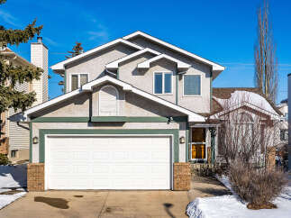 This stunning two-story home boasts a charming exterior with a spacious two-car garage and inviting curb appeal.