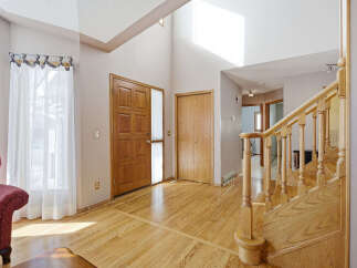 Step into this inviting home with stunning hardwood floors and a grand staircase.
