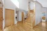 Step into this inviting home featuring a stunning staircase and beautiful hardwood floors.
