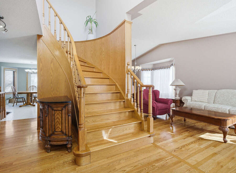 This stunning property boasts a grand staircase, a focal point of the home's elegant design.