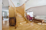 This stunning property boasts a grand staircase, a focal point of the home's elegant design.