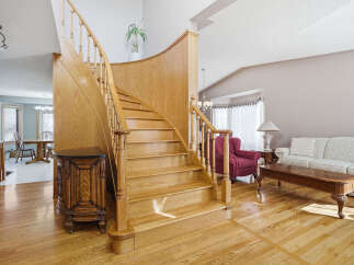 This stunning property boasts a grand staircase, a focal point of the home's elegant design.