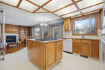Step into this inviting kitchen, featuring a stylish island with a cooktop, perfect for culinary creations.