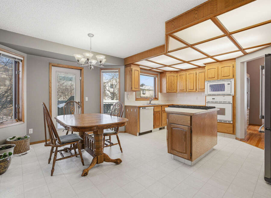 This charming kitchen boasts a warm and inviting atmosphere, perfect for family gatherings and culinary adventures.